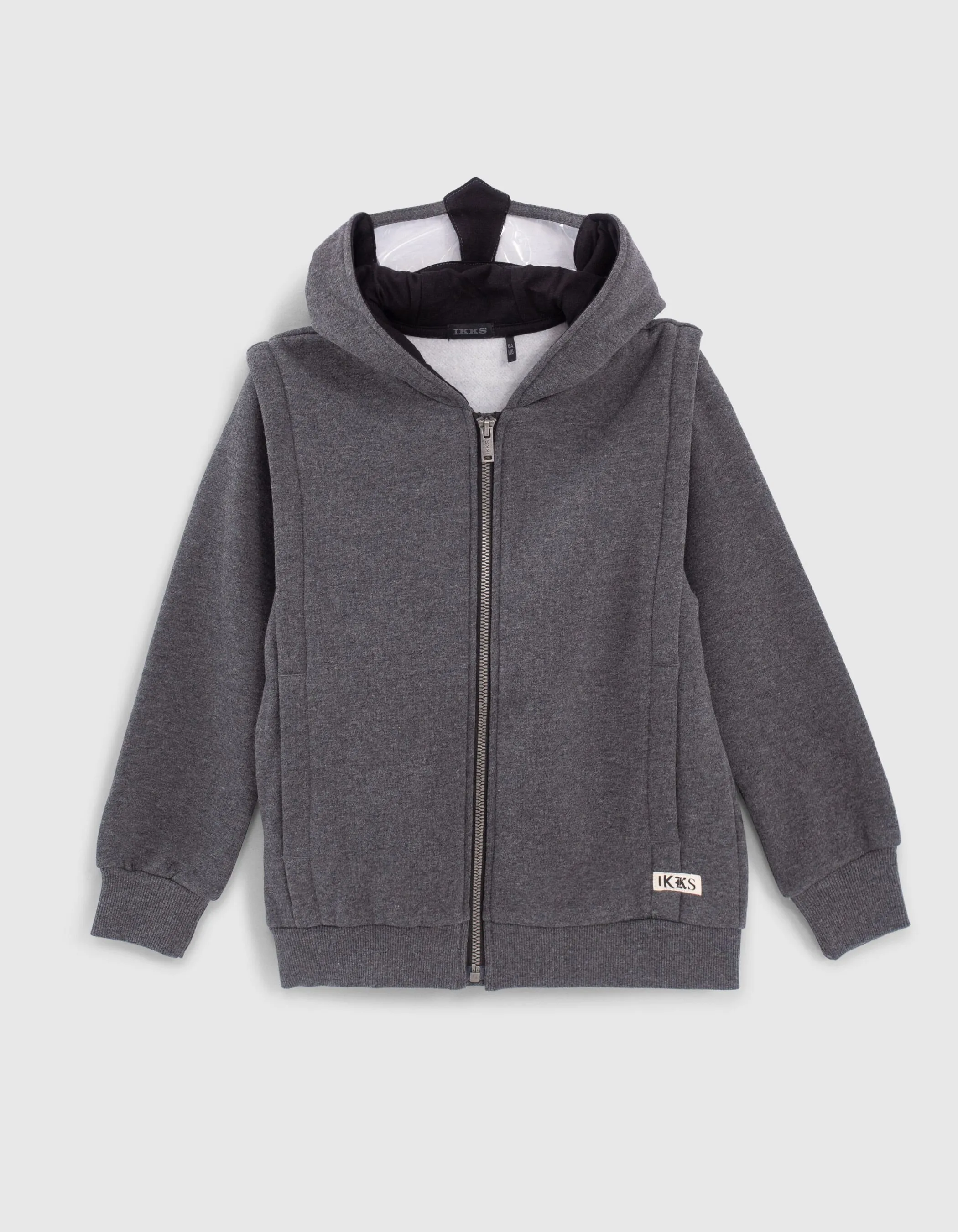 Gray cardigan with knight boy helmet.