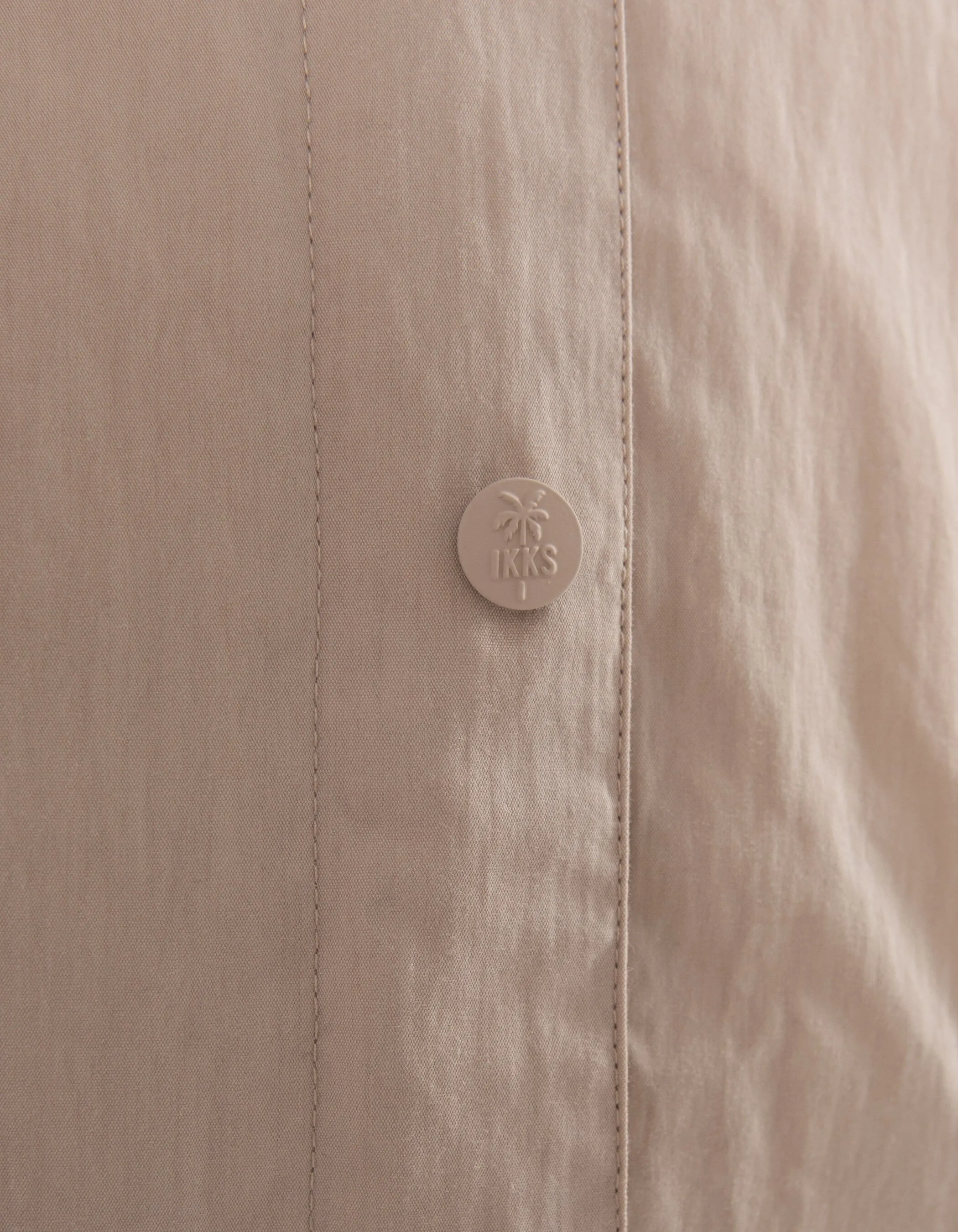 Beige trench coat with fancy details and hood for girls.